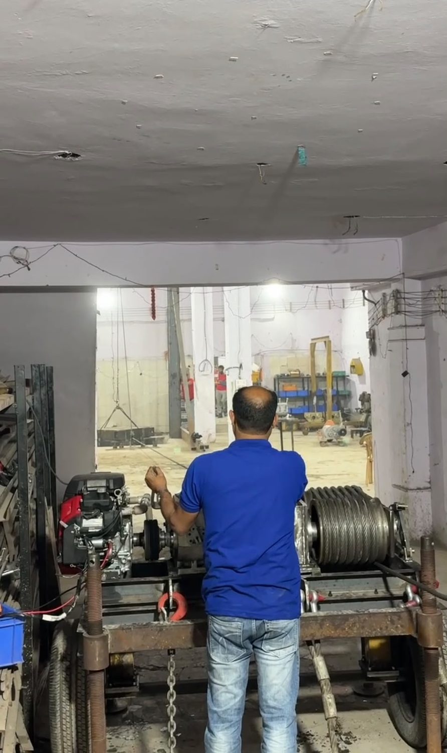 A BMC Power winch anchored to the test bench during a load test