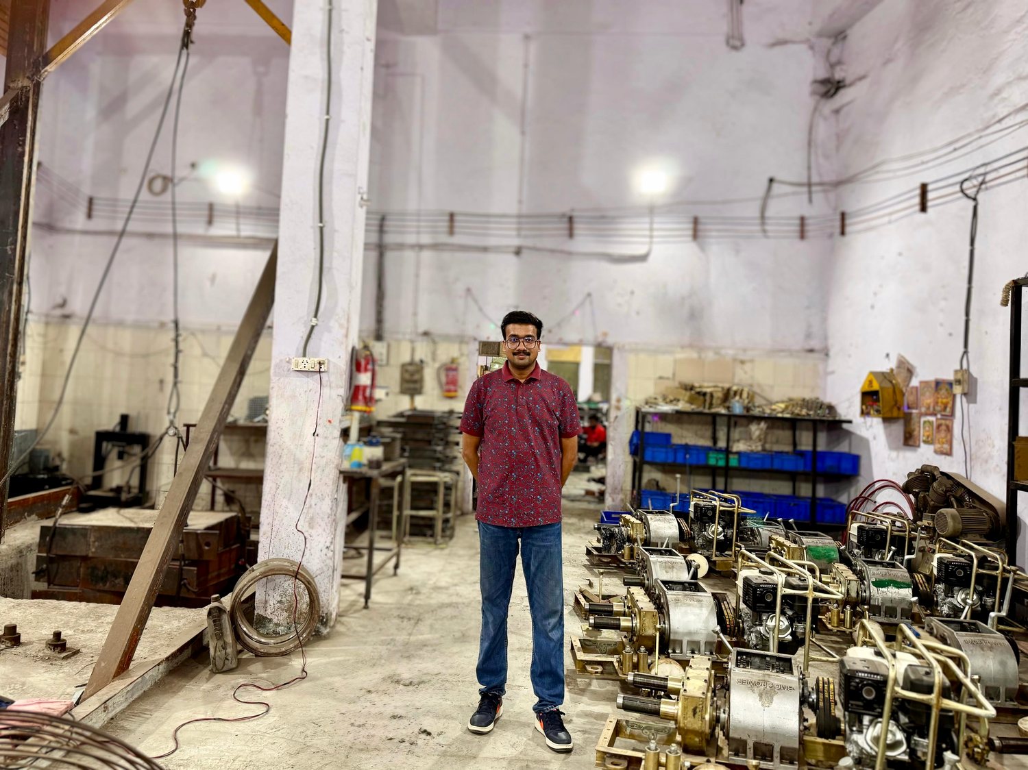 Vardhman Ranjan on the shop floor at the BMC Power works, beside a line of assembled winches